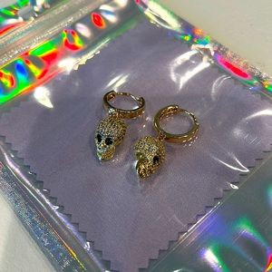 Gold crystal pavé skull earrings with gold plated earring huggie. New/Handmade